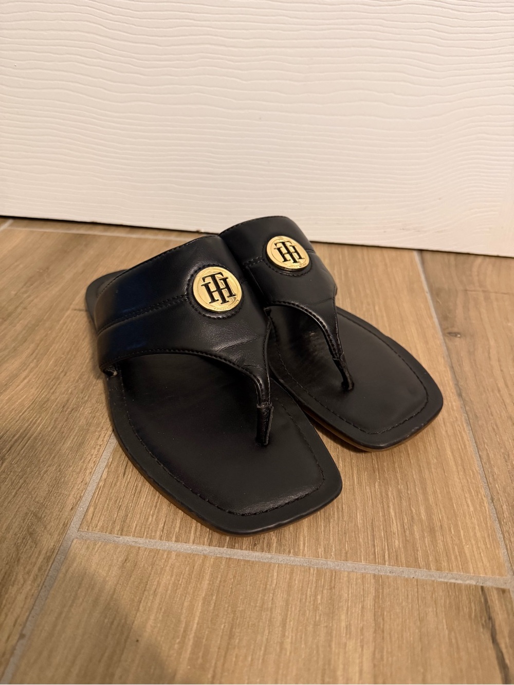 Tommy Hilfiger Black Leather Thong Sandals with Gold Emblem